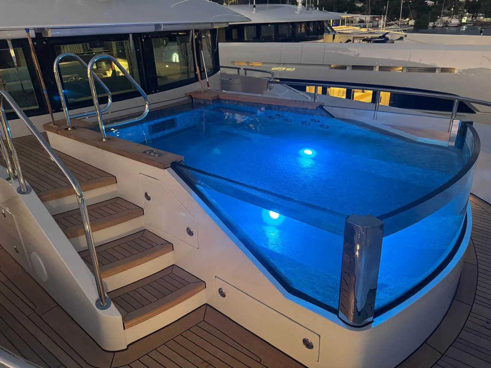 Luxury superyacht at midday over turquoise water